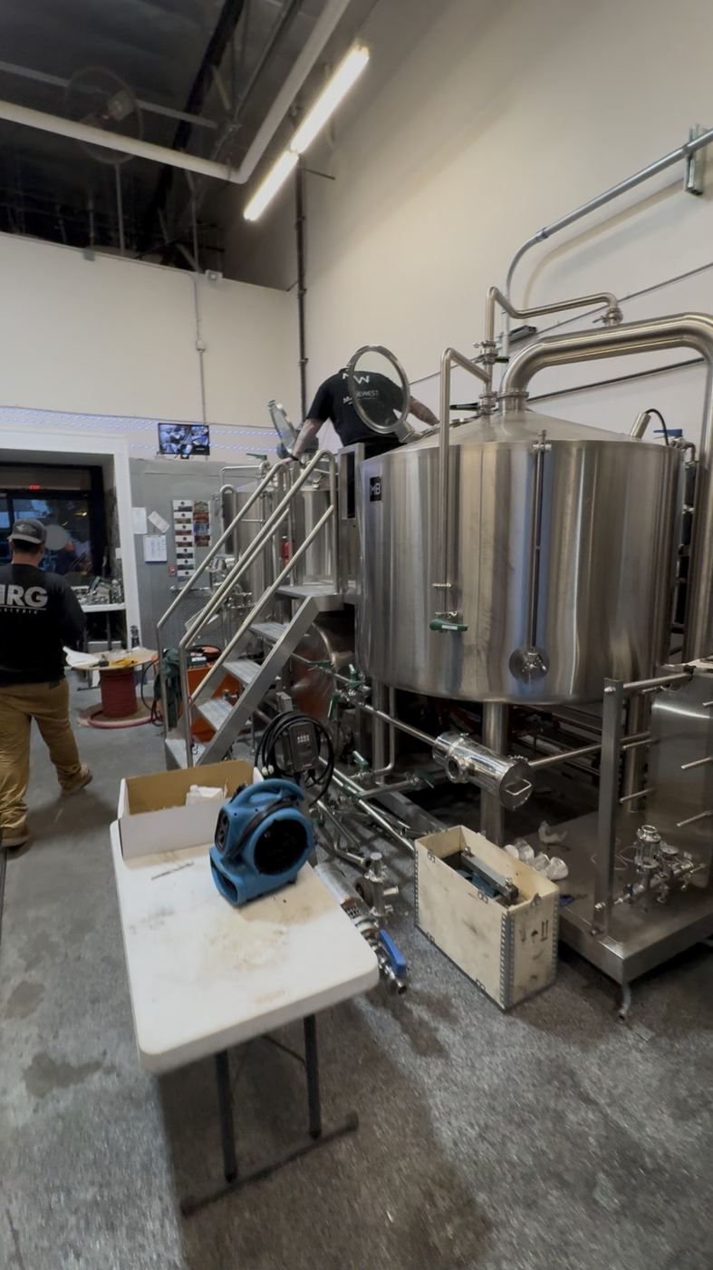 Brewery TI - stainless tanks, NRG crew on the platform
