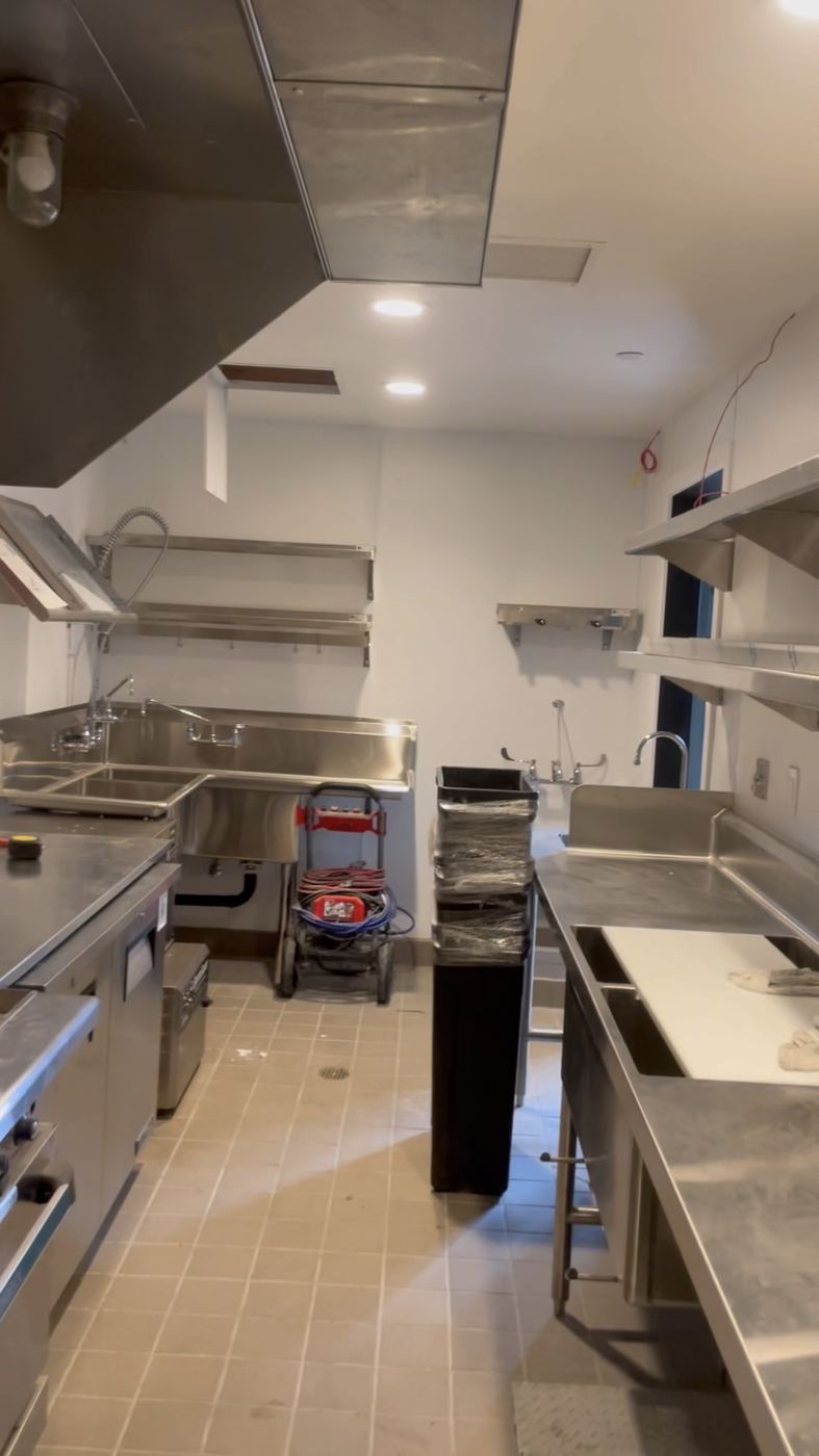 Commercial kitchen build-out - stainless line, shelving, sinks
