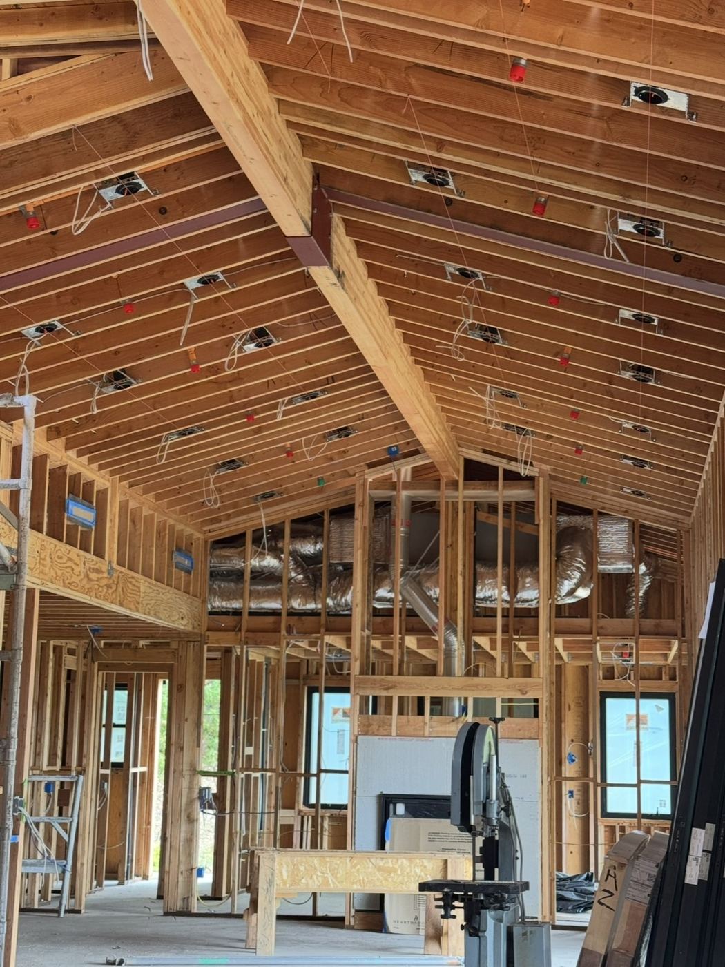 Vaulted framing with can lights and ducting roughed in