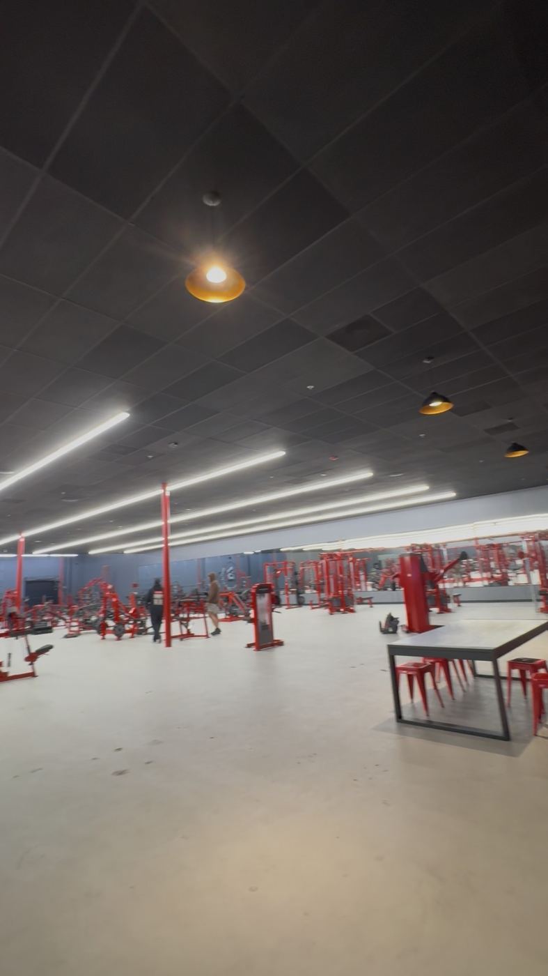 Gym floor with equipment set, black ceiling with pendants