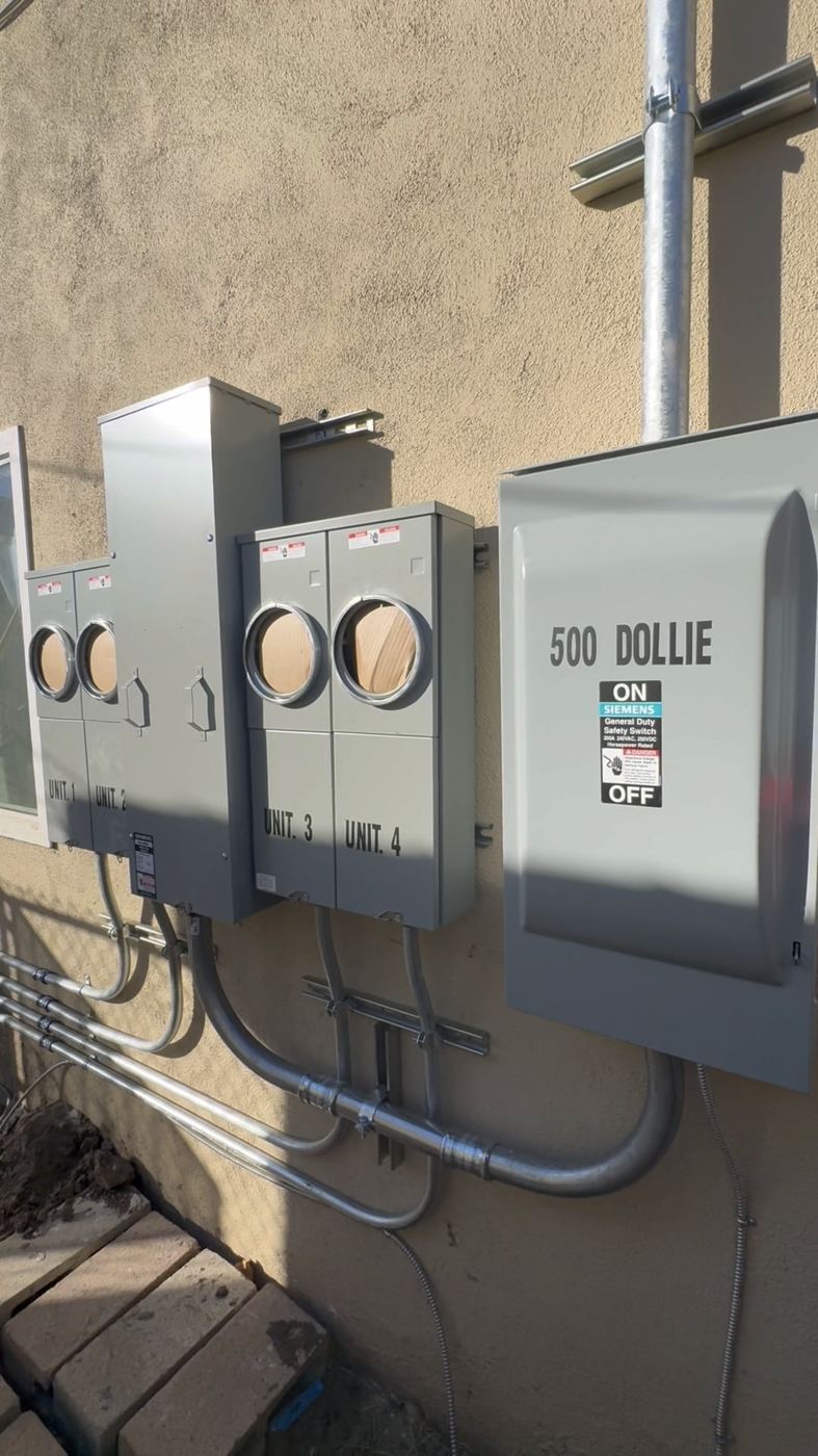 Multifamily meter bank + disconnect service upgrade, clean conduit work