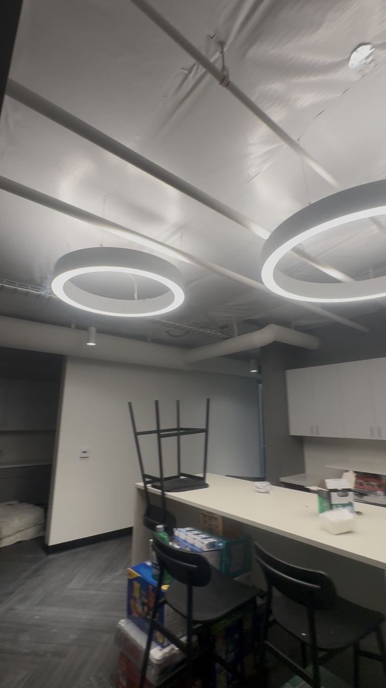 Break room with ring pendant fixtures