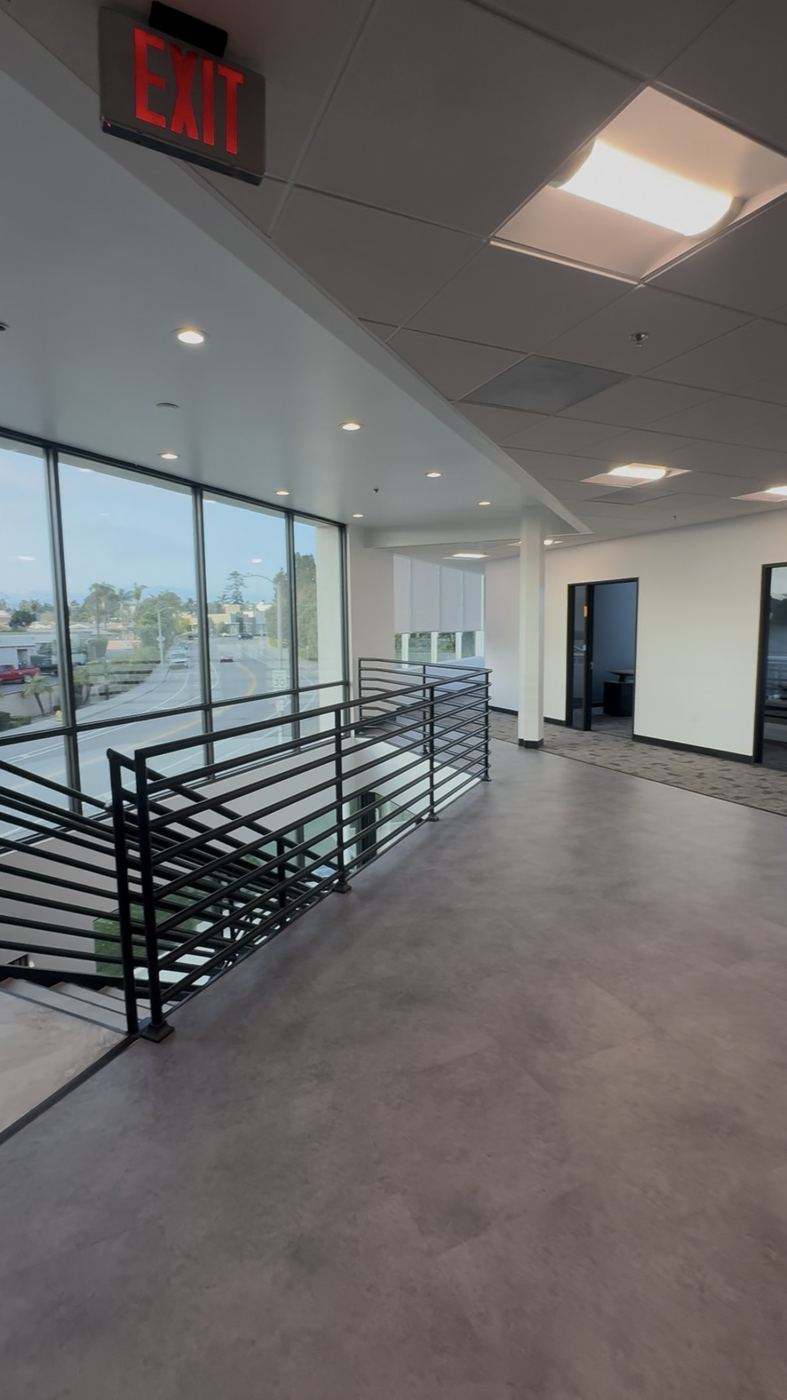 Finished office mezzanine level, glass line and exit signage