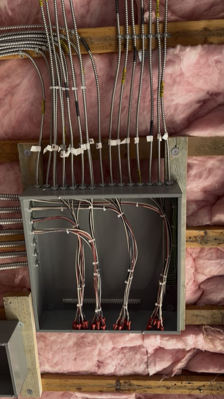 Electrical rough-in - MC cable dressed into junction boxes over insulation