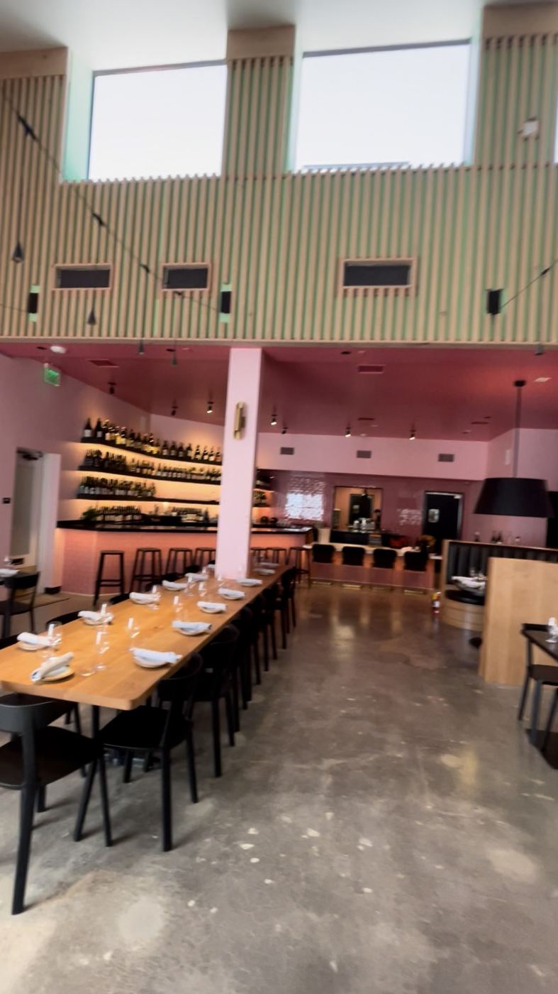 Finished restaurant TI - wine wall, slat mezzanine, dining room set