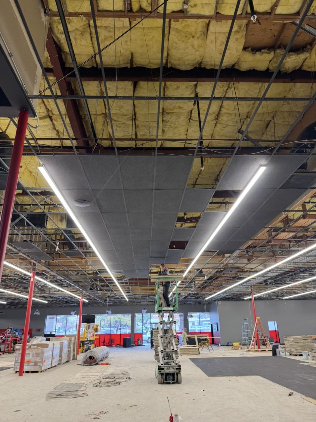 Retail TI ceiling renovation - new linear LEDs going in on lifts