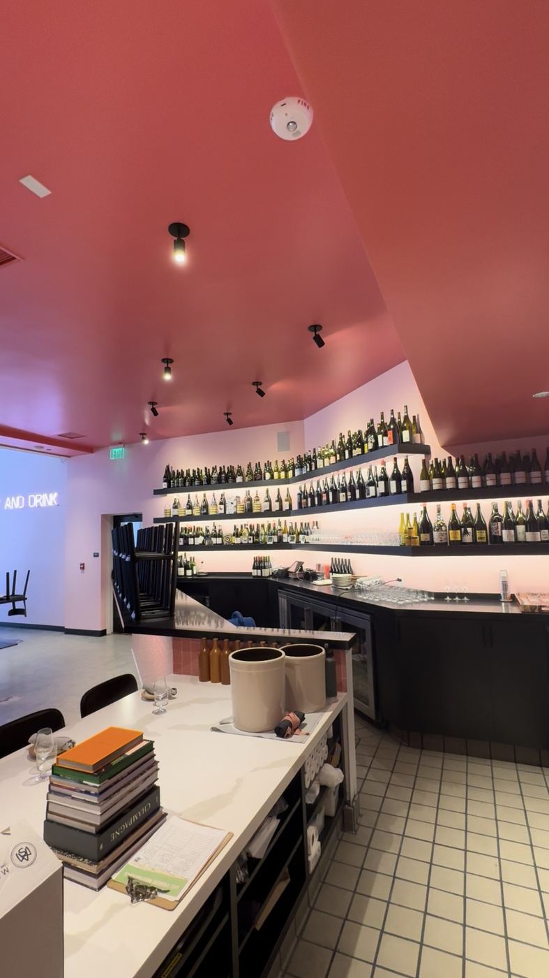 Finished wine bar TI - red ceiling, bottle wall, tiled service counter