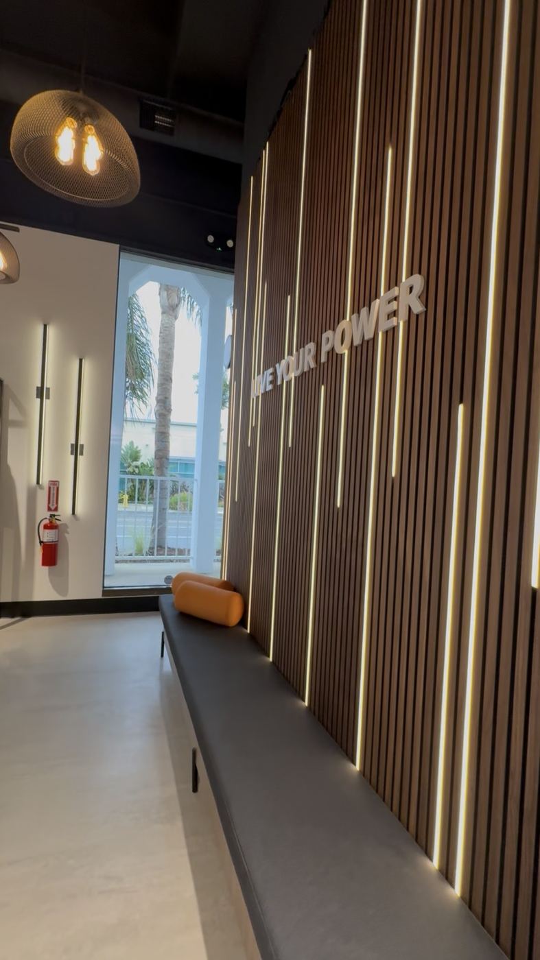 Yoga studio slat-wall lounge with integrated LED strips